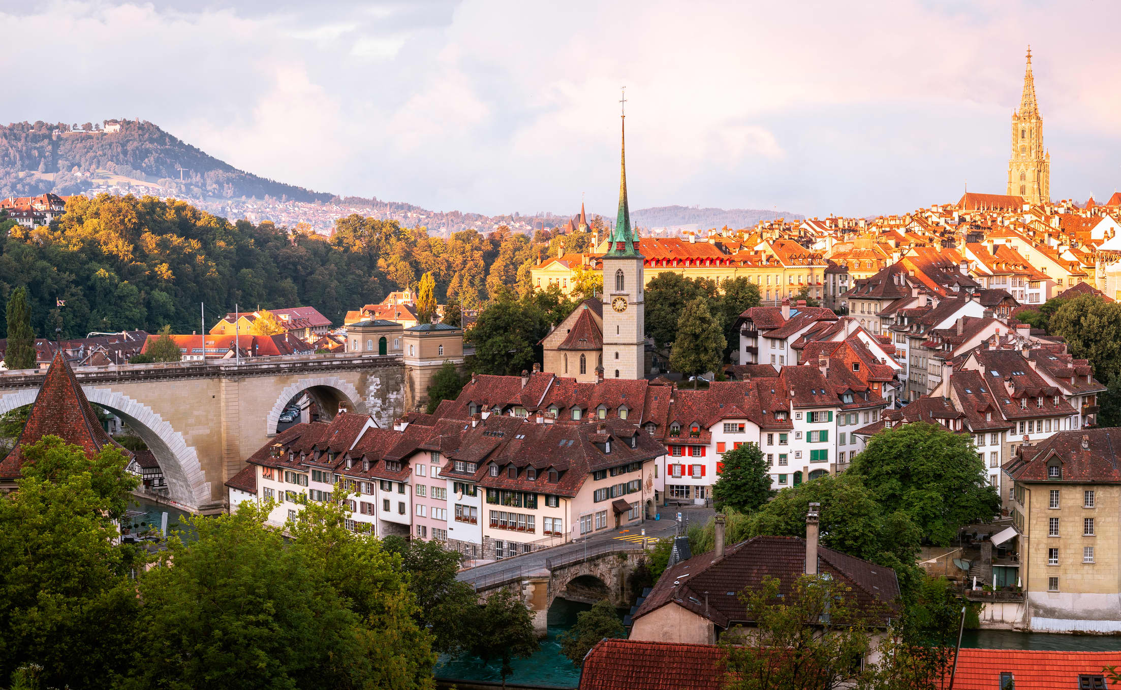 Bern Skyline taken from the Rosengarten at sunrise in Switzerland. Church centre: Nydeggkirche
Cathedral right: Berner Münster
Bridge left: Nydeggbrücke